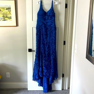 Blue, floor length, formal dress with a small train